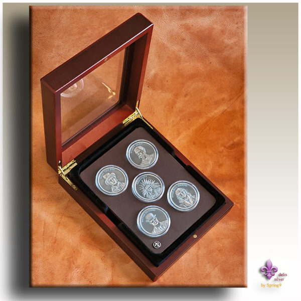 presentation case with five coins in capsules