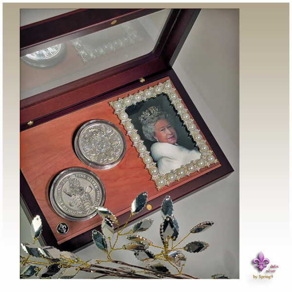 presentation case with picture frame and two coins