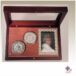 presentation case with picture frame and two coins
