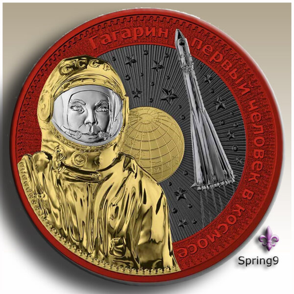 Red Gagarin in astronaut suit on a silver coin gilded