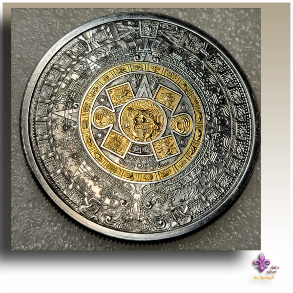 gilded Aztec Callendar coin in a capsule