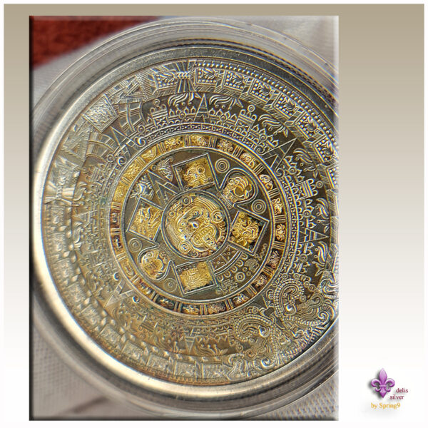 gilded Aztec Callendar coin in a capsule