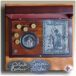 presentation case with a picture and a silver coin