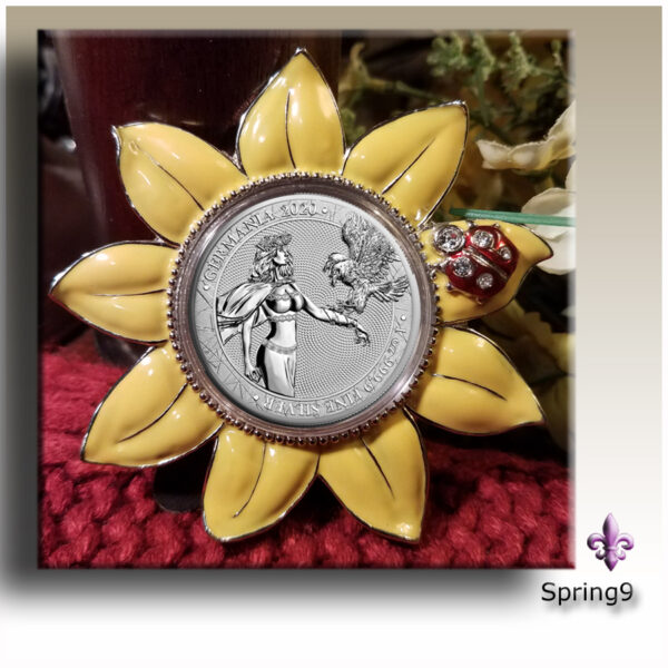 a picture of a flower with Germania coin