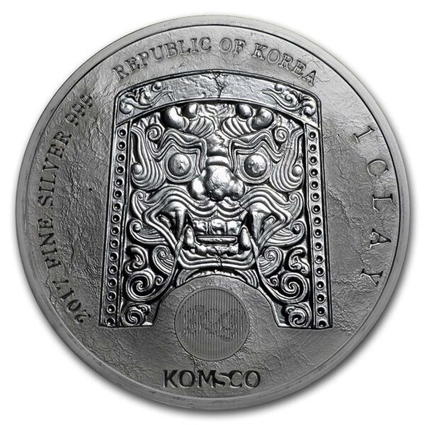 a silver coin with a lion face