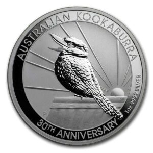 a silver coin with a bird on it