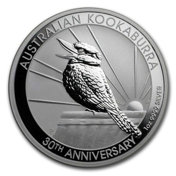 a silver coin with a bird on it