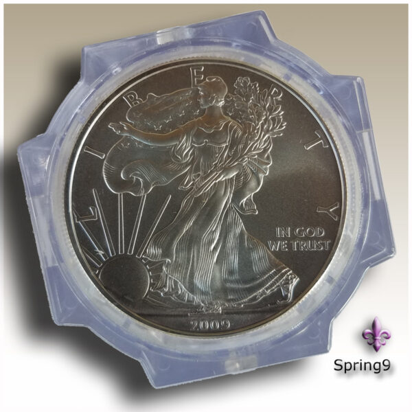 a silver coin in a plastic container