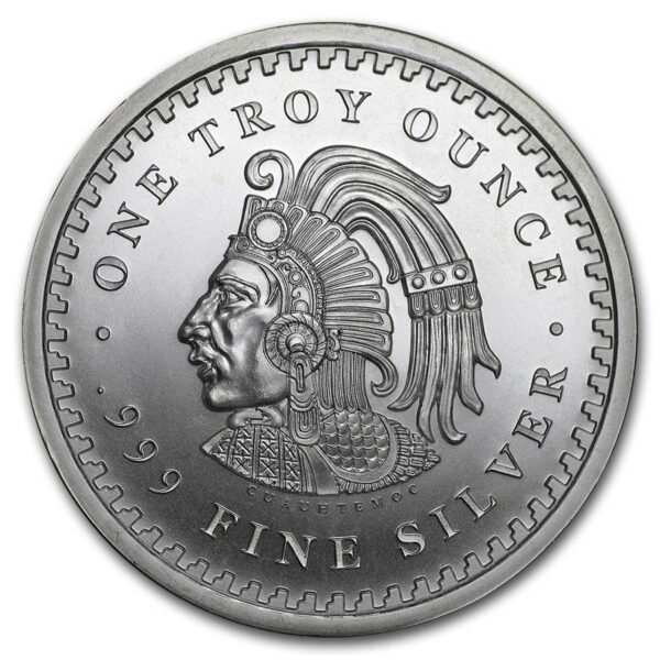 a silver coin with a face and text