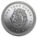 a silver coin with a face and text