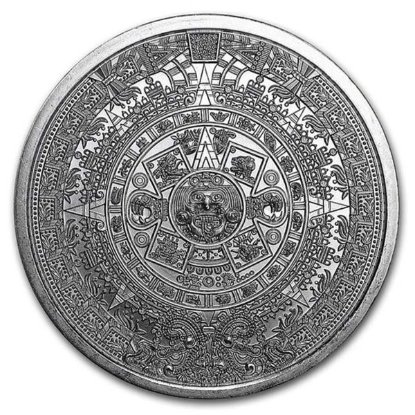 a silver coin with a design on it