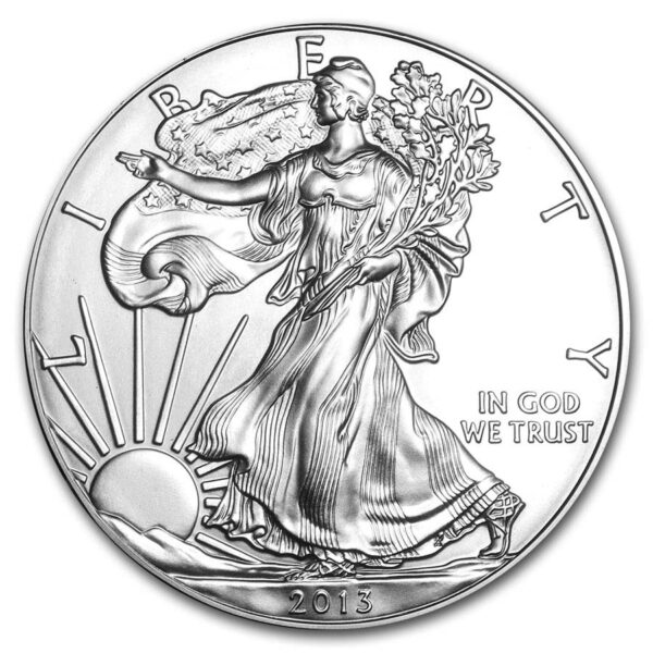 a silver coin with a woman holding a tree