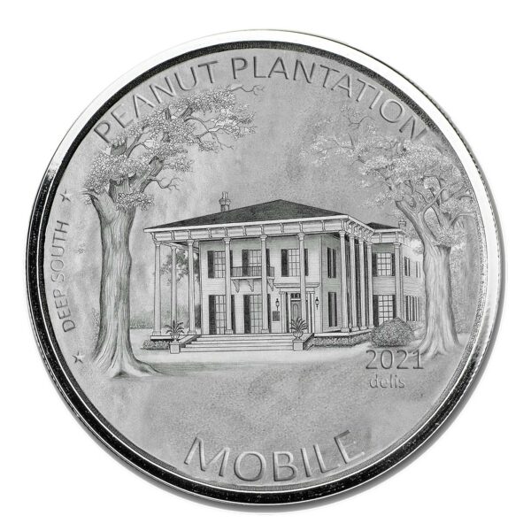 a silver coin with a picture of a building