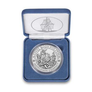 a silver coin in a blue box