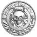 a silver coin with a skull on it